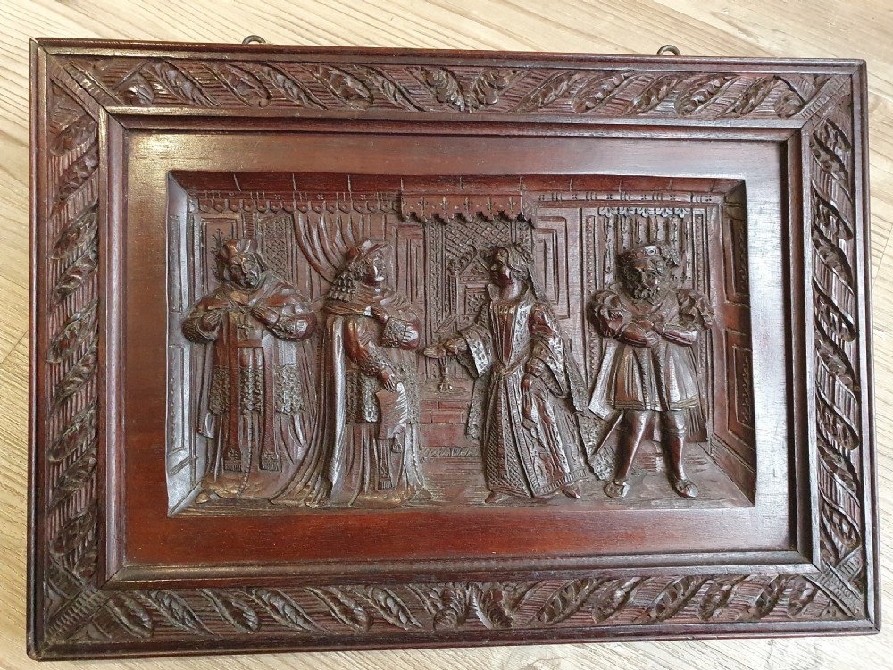 A Victorian Mahogany Carved Relief Panel Depicting Tudor Interior Scene View III