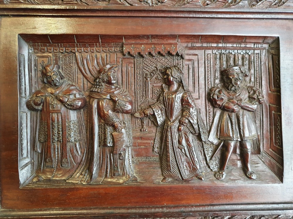 A Victorian Mahogany Carved Relief Panel Depicting Tudor Interior Scene View IV