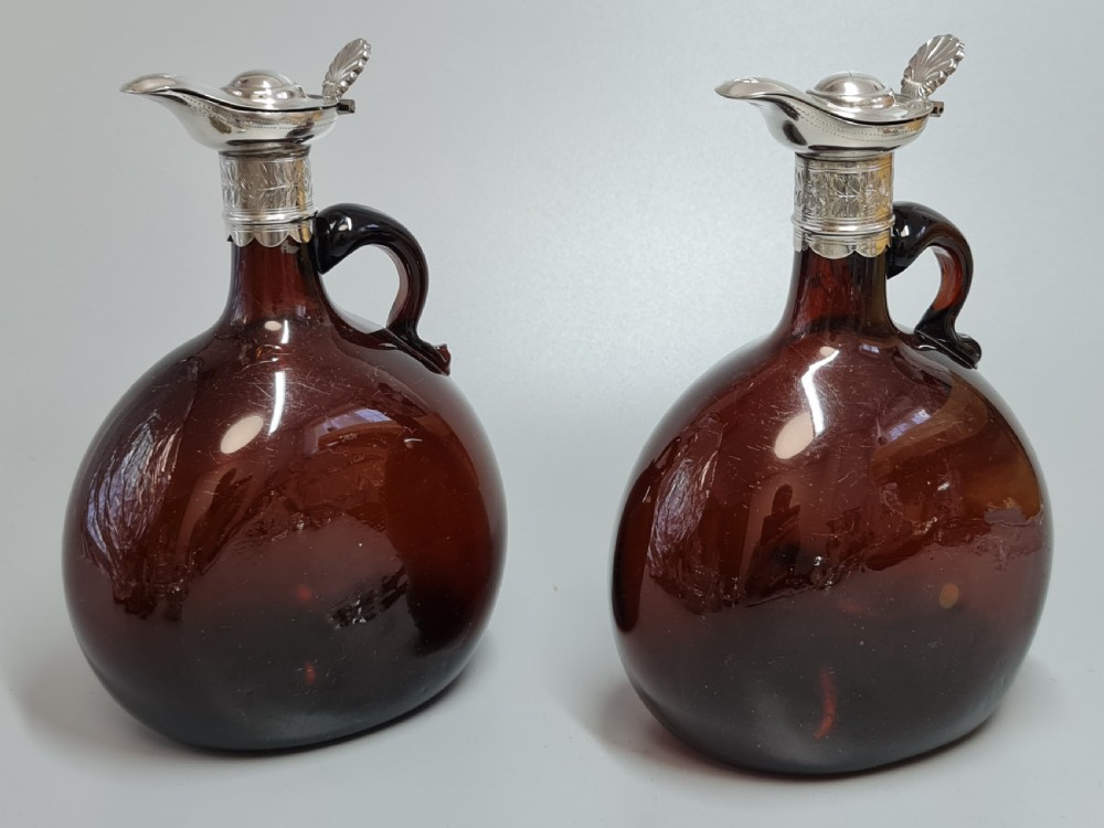 Superb Pair19th Century Matched Dark Amber Glass Decanters with Engraved Silver Plate Mounts