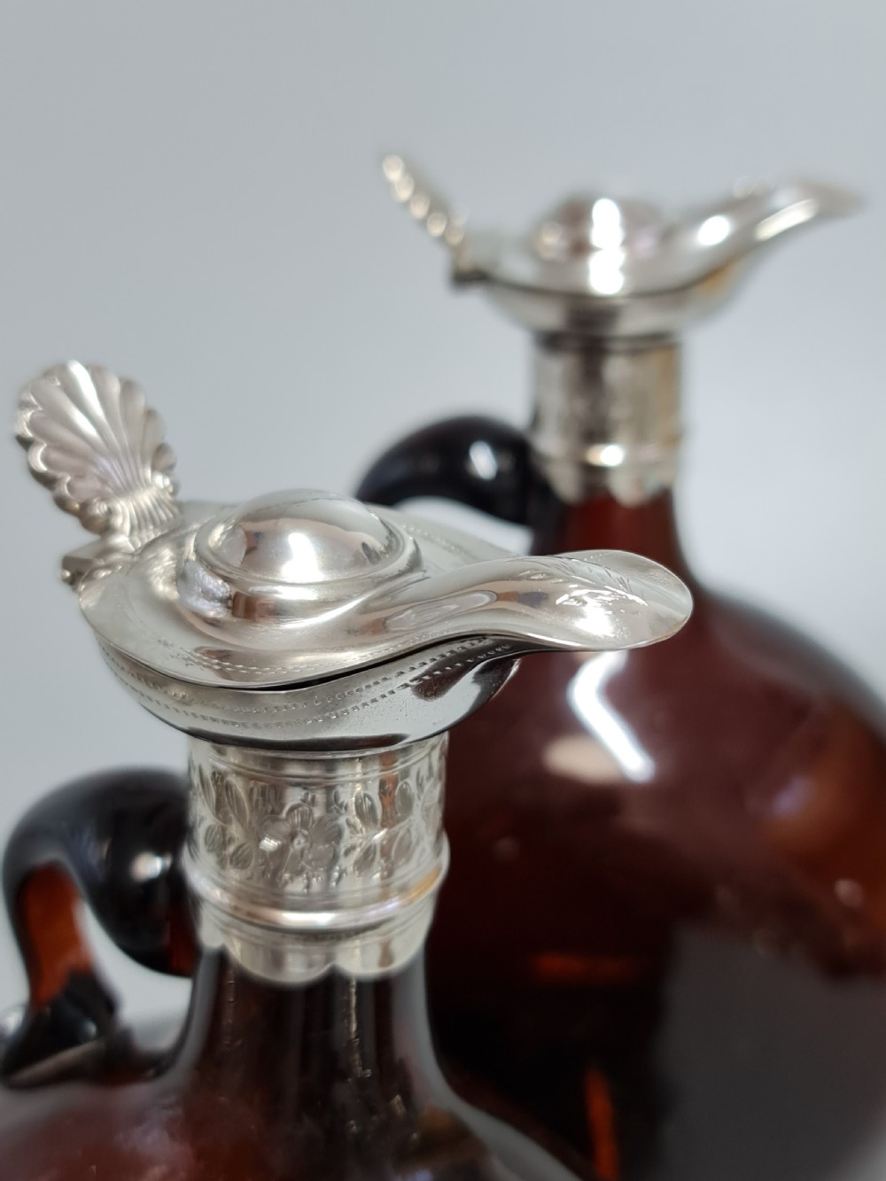 Superb Pair19th Century Matched Dark Amber Glass Decanters with Engraved Silver Plate Mounts View V