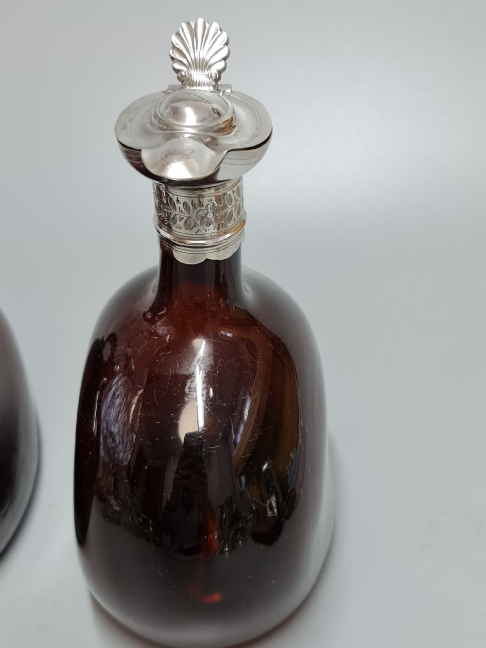 Superb Pair19th Century Matched Dark Amber Glass Decanters with Engraved Silver Plate Mounts View IX