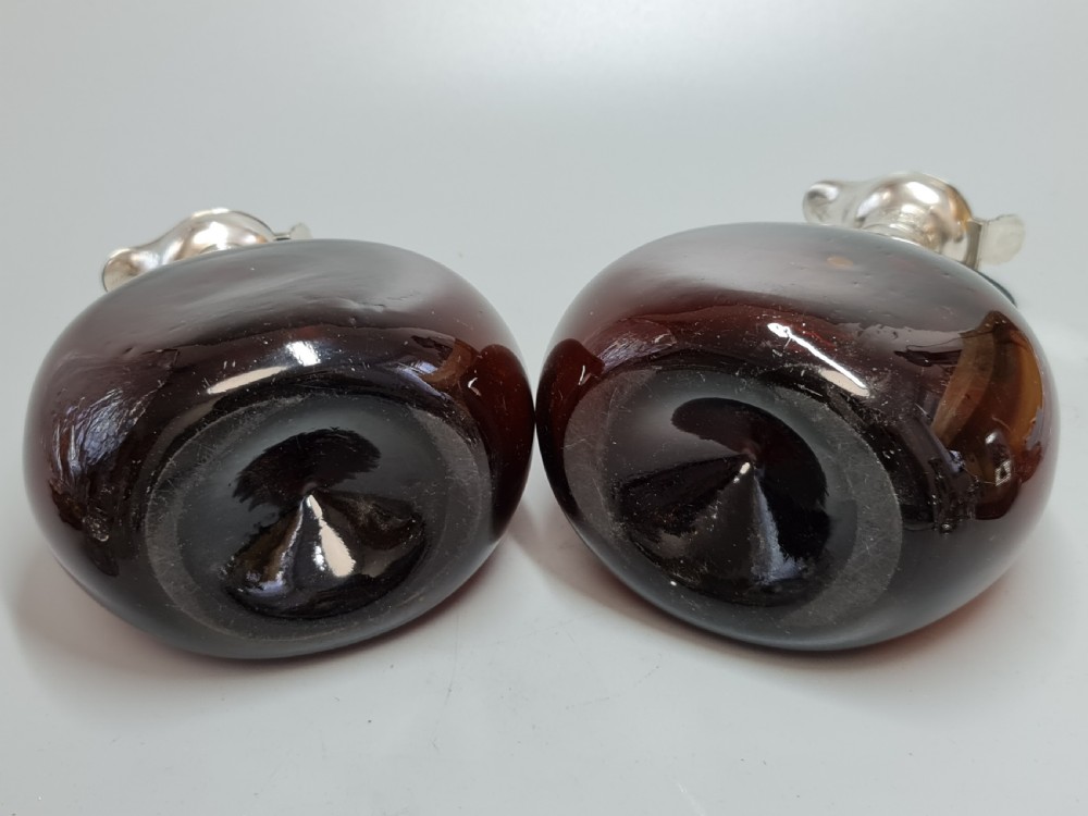 Superb Pair19th Century Matched Dark Amber Glass Decanters with Engraved Silver Plate Mounts View X