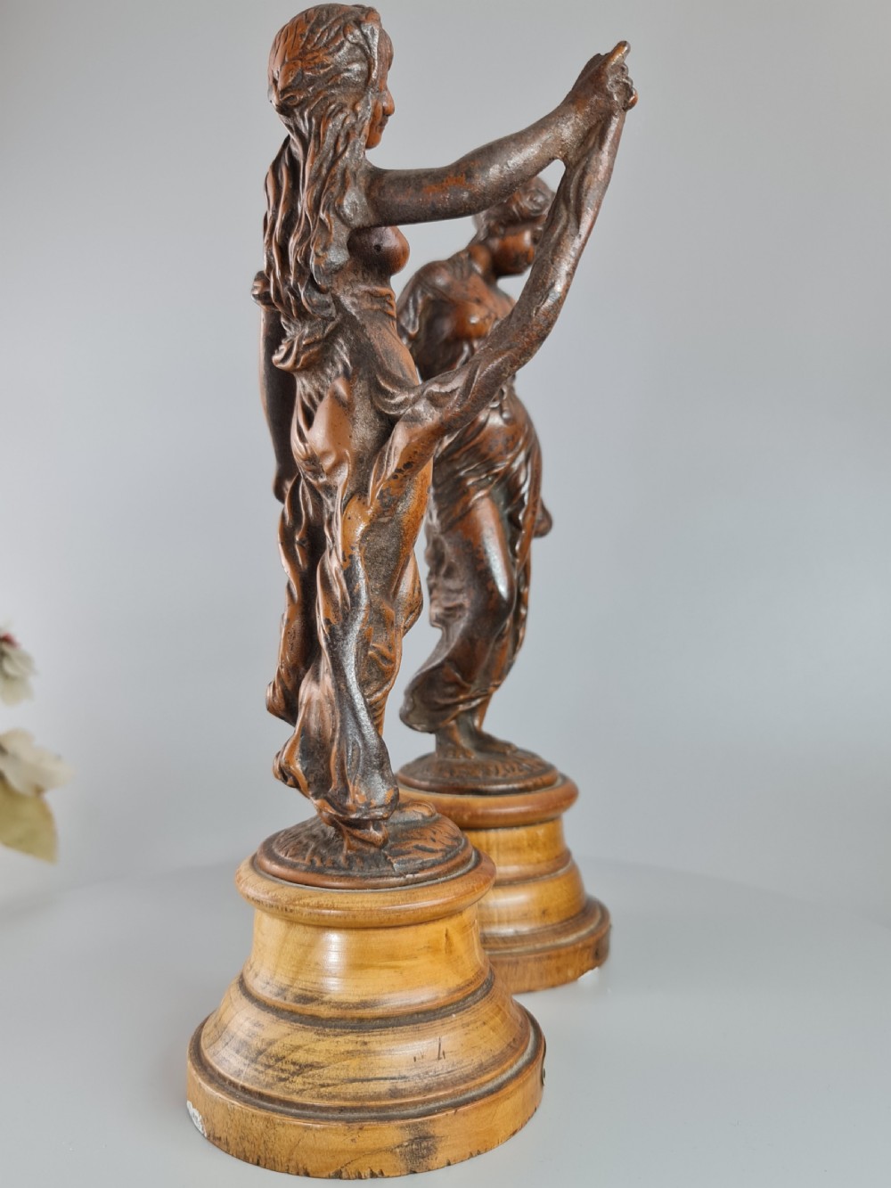 PAIR OF NEOCLASSICAL STYLE SPELTER FIGURES OF 'MODESTY' AND 'GAIETY' on wooden plinths c1900 View III