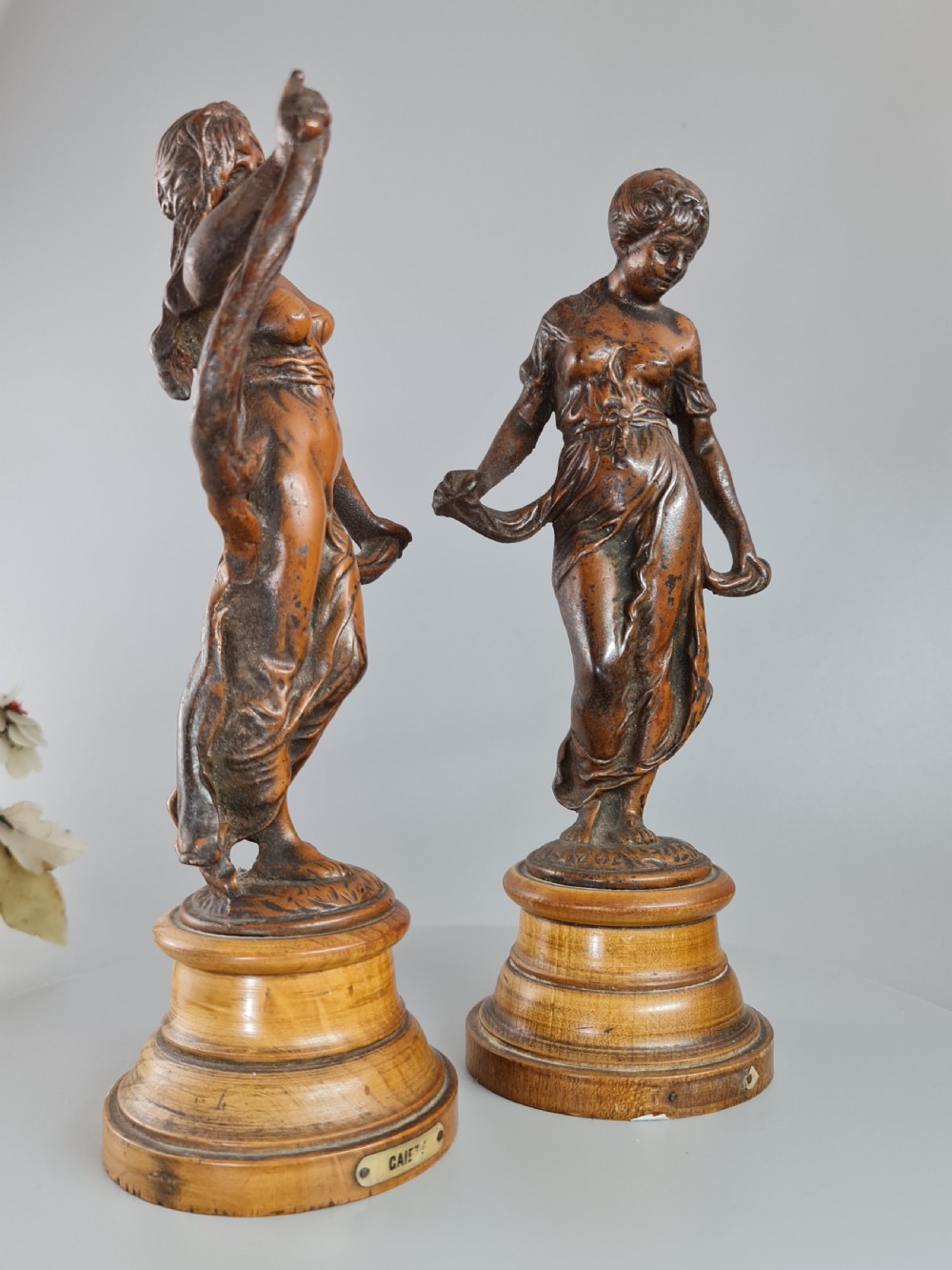 PAIR OF NEOCLASSICAL STYLE SPELTER FIGURES OF 'MODESTY' AND 'GAIETY' on wooden plinths c1900 View IV