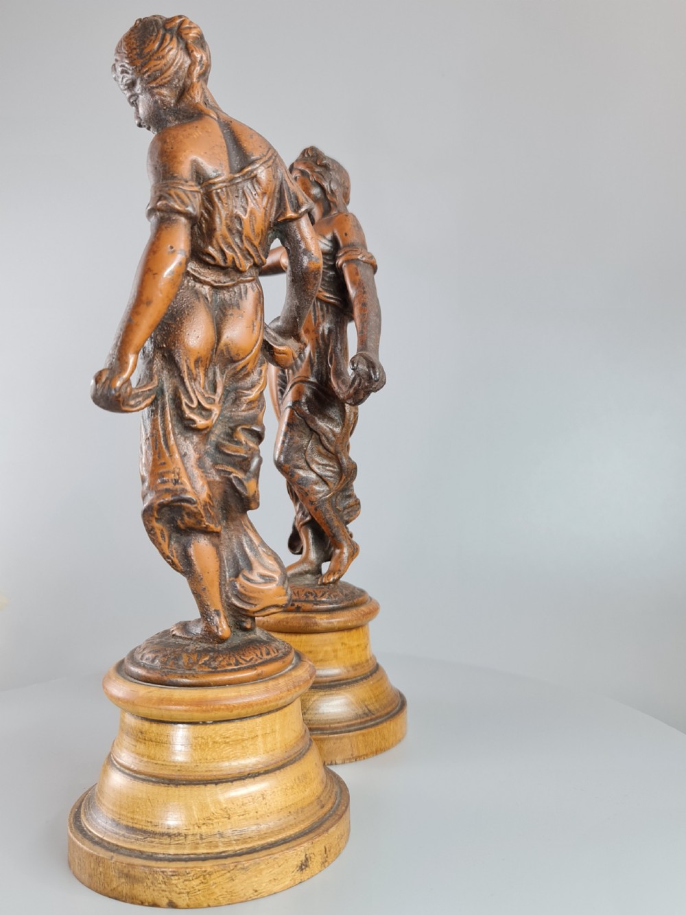 PAIR OF NEOCLASSICAL STYLE SPELTER FIGURES OF 'MODESTY' AND 'GAIETY' on wooden plinths c1900 View VII