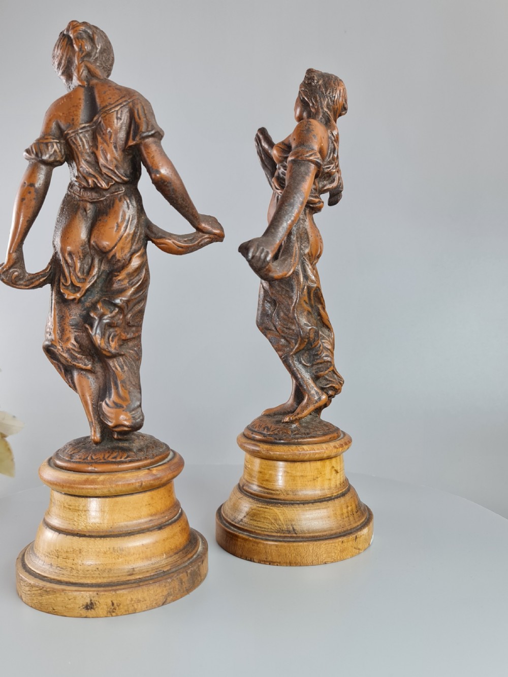 PAIR OF NEOCLASSICAL STYLE SPELTER FIGURES OF 'MODESTY' AND 'GAIETY' on wooden plinths c1900 View VIII