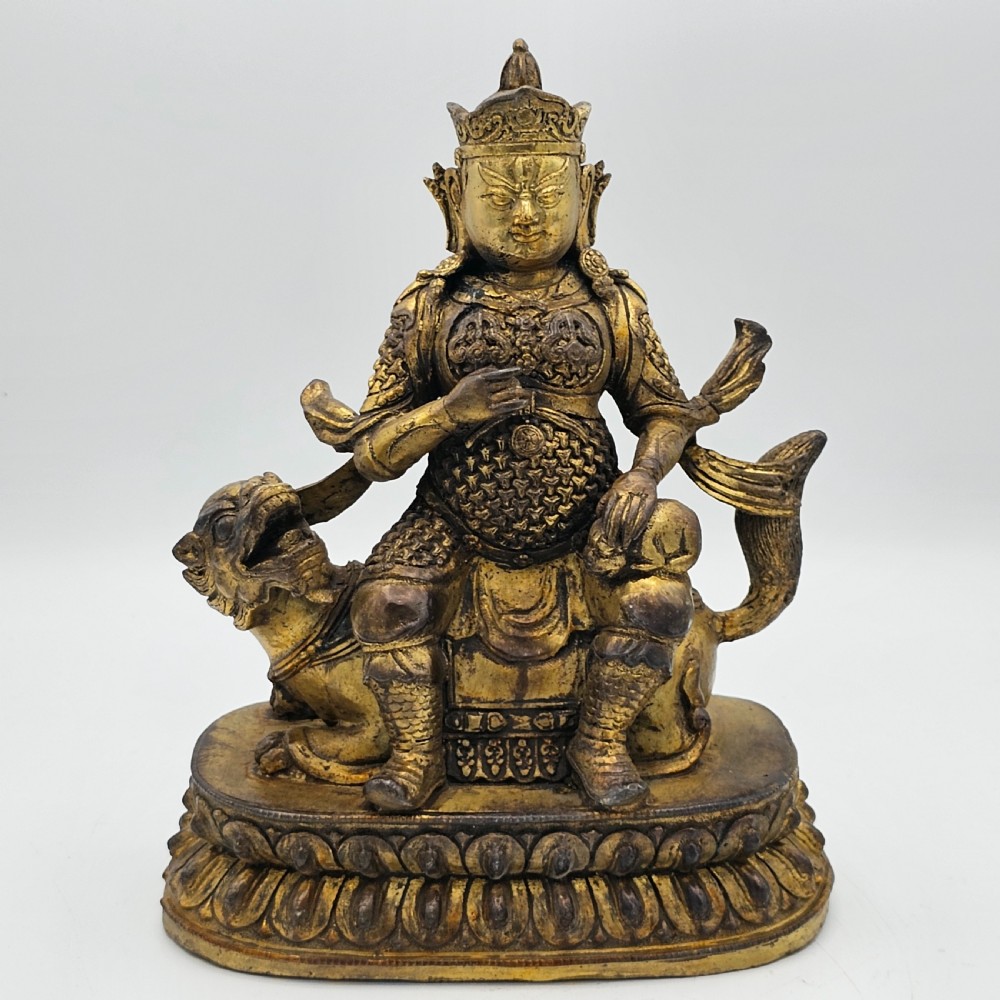 Antique Sino Tibetan Gilt Bronze Deity Astride a Kylin