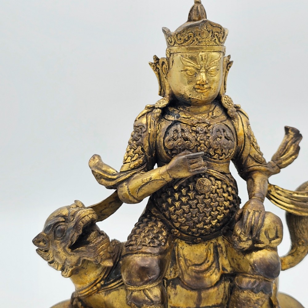 Antique Sino Tibetan Gilt Bronze Deity Astride a Kylin View IV