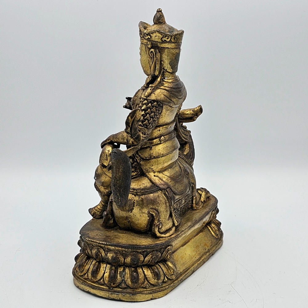 Antique Sino Tibetan Gilt Bronze Deity Astride a Kylin View VI