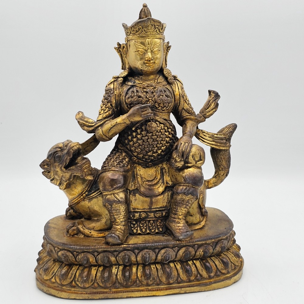 Antique Sino Tibetan Gilt Bronze Deity Astride a Kylin View VIII