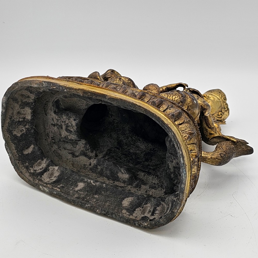 Antique Sino Tibetan Gilt Bronze Deity Astride a Kylin View IX