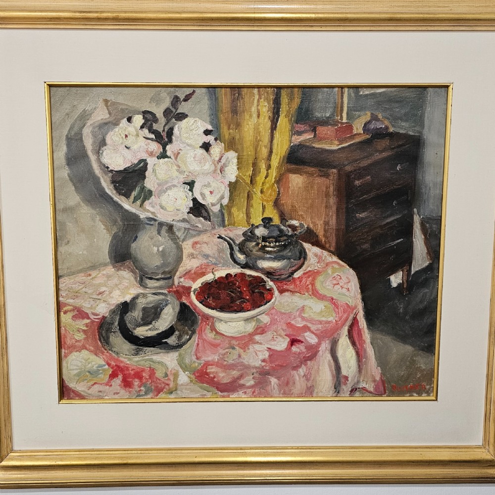 A framed oil painting depicting a detailed still life scene with a vase of white flowers, a teapot, a bowl of cherries, and a hat on a pink patterned tablecloth. View VI