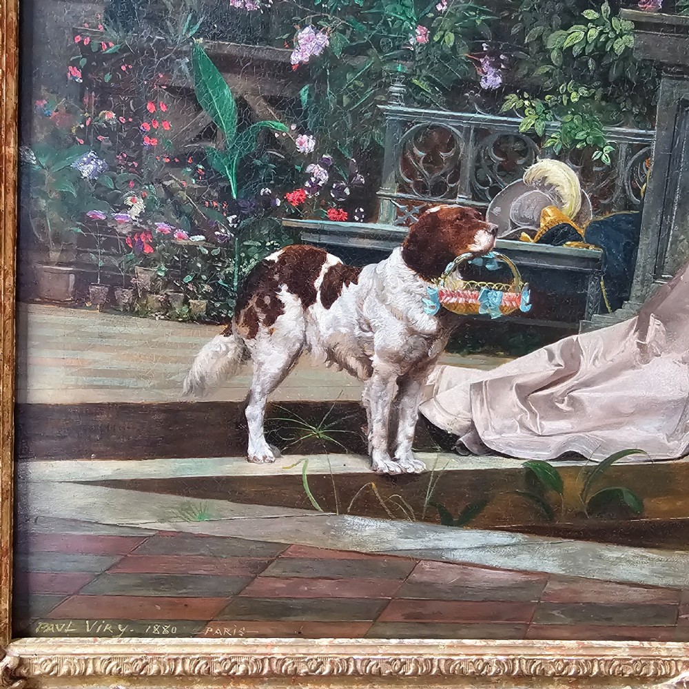 An 1880 framed oil painting depicting a woman in a pink dress beside a garden fountain with birds, presented in a heavily carved gilded frame. View II