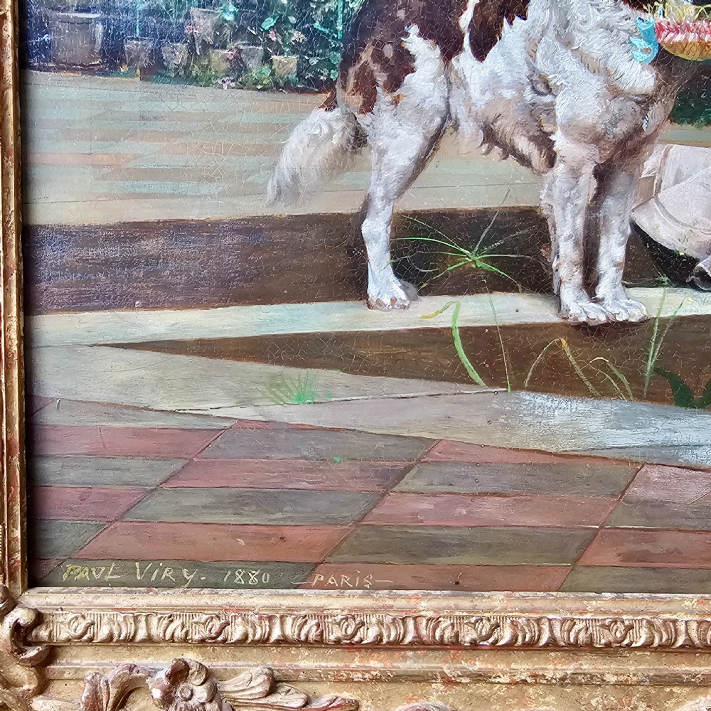 An 1880 framed oil painting depicting a woman in a pink dress beside a garden fountain with birds, presented in a heavily carved gilded frame. View X