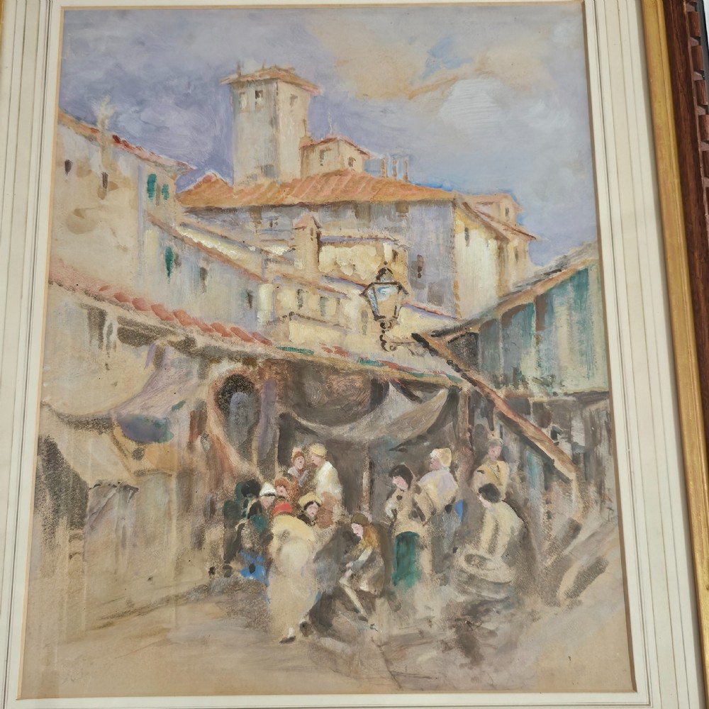 A framed Victorian watercolour painting depicting a European town market square with figures, architectural details, and a central tower in soft earth tones. View VI