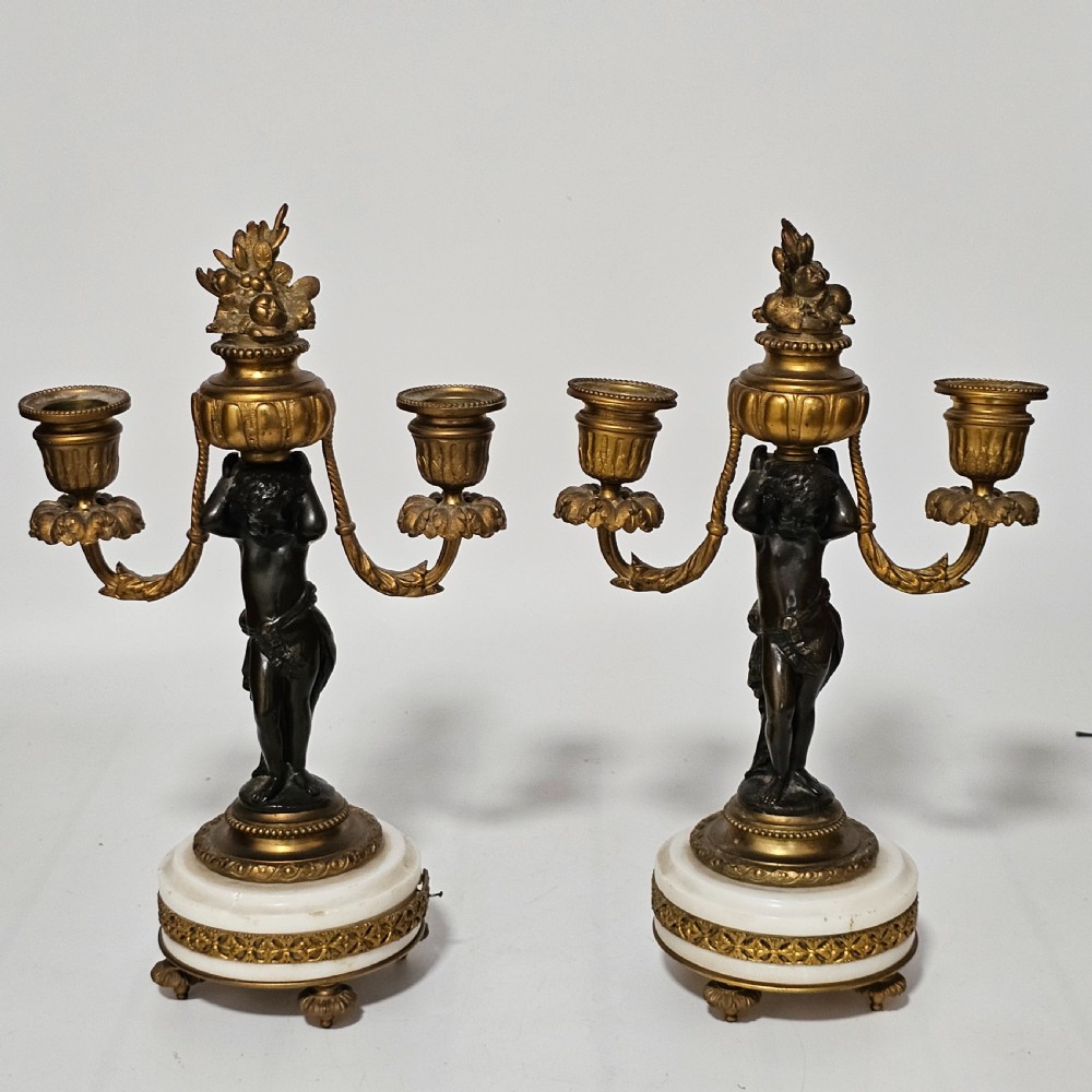 A pair of French Louis XVI-style marble and ormolu two-light candelabra, 20th Century. View II