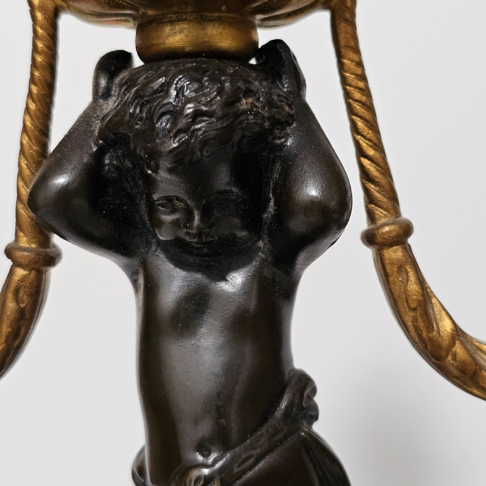 A pair of French Louis XVI-style marble and ormolu two-light candelabra, 20th Century. View III