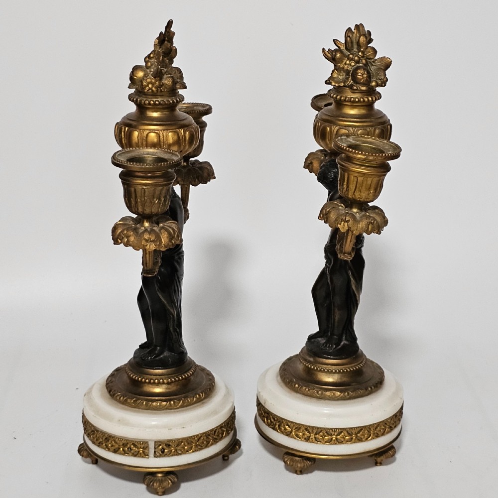 A pair of French Louis XVI-style marble and ormolu two-light candelabra, 20th Century. View V