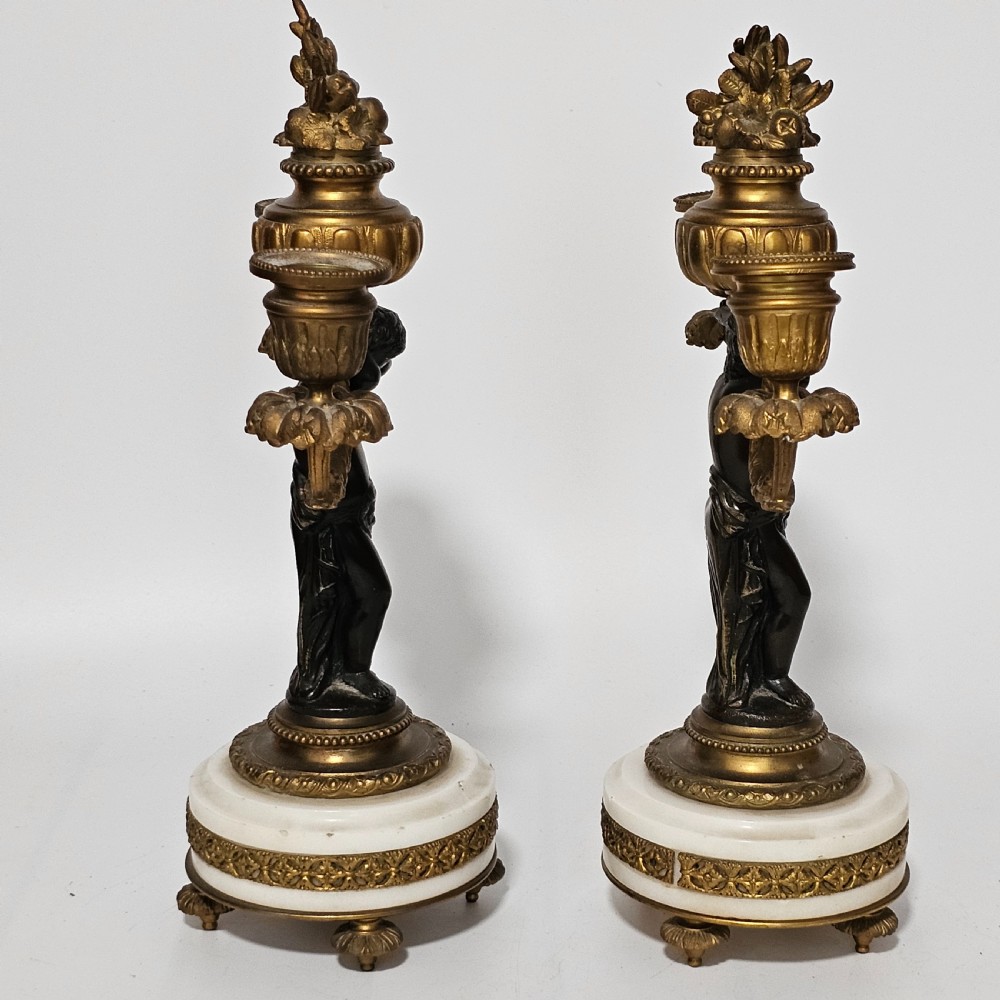 A pair of French Louis XVI-style marble and ormolu two-light candelabra, 20th Century. View VI