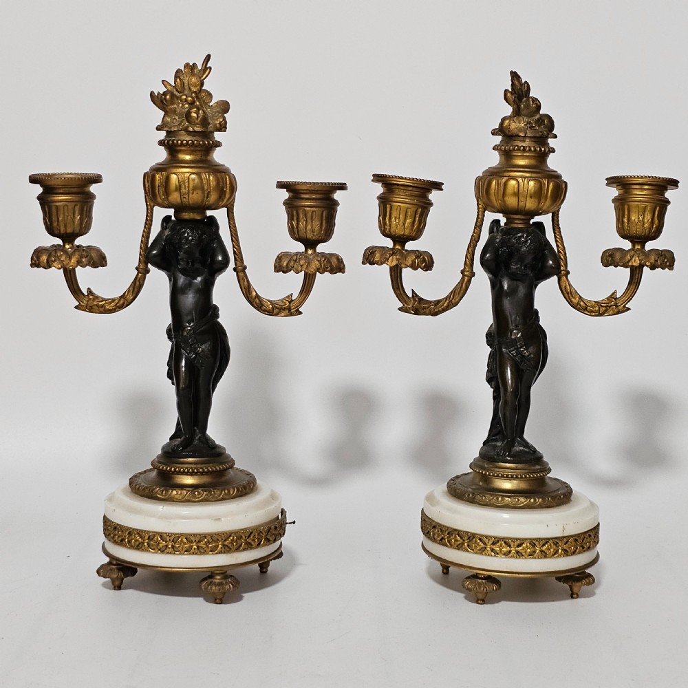 A pair of French Louis XVI-style marble and ormolu two-light candelabra, 20th Century. View VII