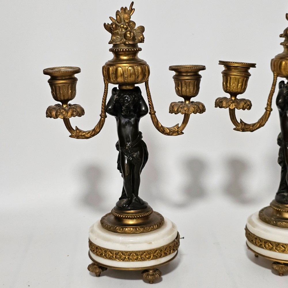 A pair of French Louis XVI-style marble and ormolu two-light candelabra, 20th Century. View VIII