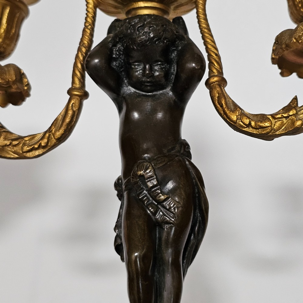 A pair of French Louis XVI-style marble and ormolu two-light candelabra, 20th Century. View X