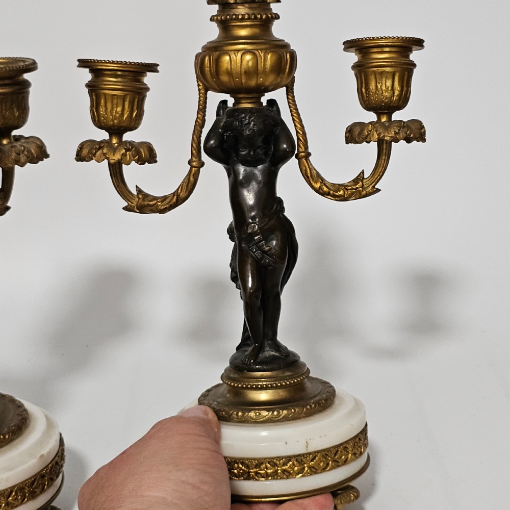 A pair of French Louis XVI-style marble and ormolu two-light candelabra, 20th Century. View XI