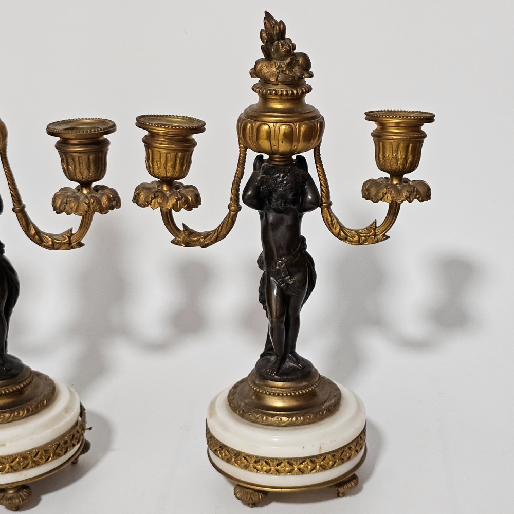 A pair of French Louis XVI-style marble and ormolu two-light candelabra, 20th Century. View XV