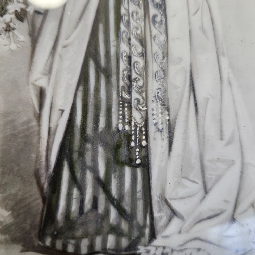 A rectangular framed porcelain plaque featuring a monochrome depiction of an Edwardian lady holding a fan within an ornate gilt frame. View IX