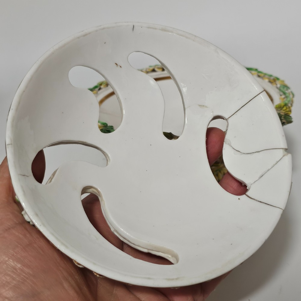 An antique circa 1830 Spode porcelain potpourri bowl with a pierced lid, featuring dense encrusted yellow and green flowers and a central pink rose finial. View III