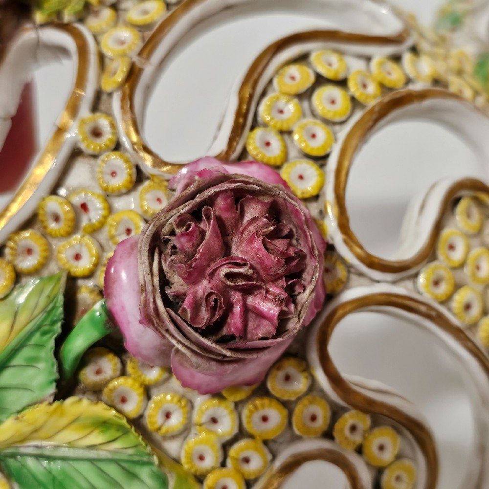 An antique circa 1830 Spode porcelain potpourri bowl with a pierced lid, featuring dense encrusted yellow and green flowers and a central pink rose finial. View XII