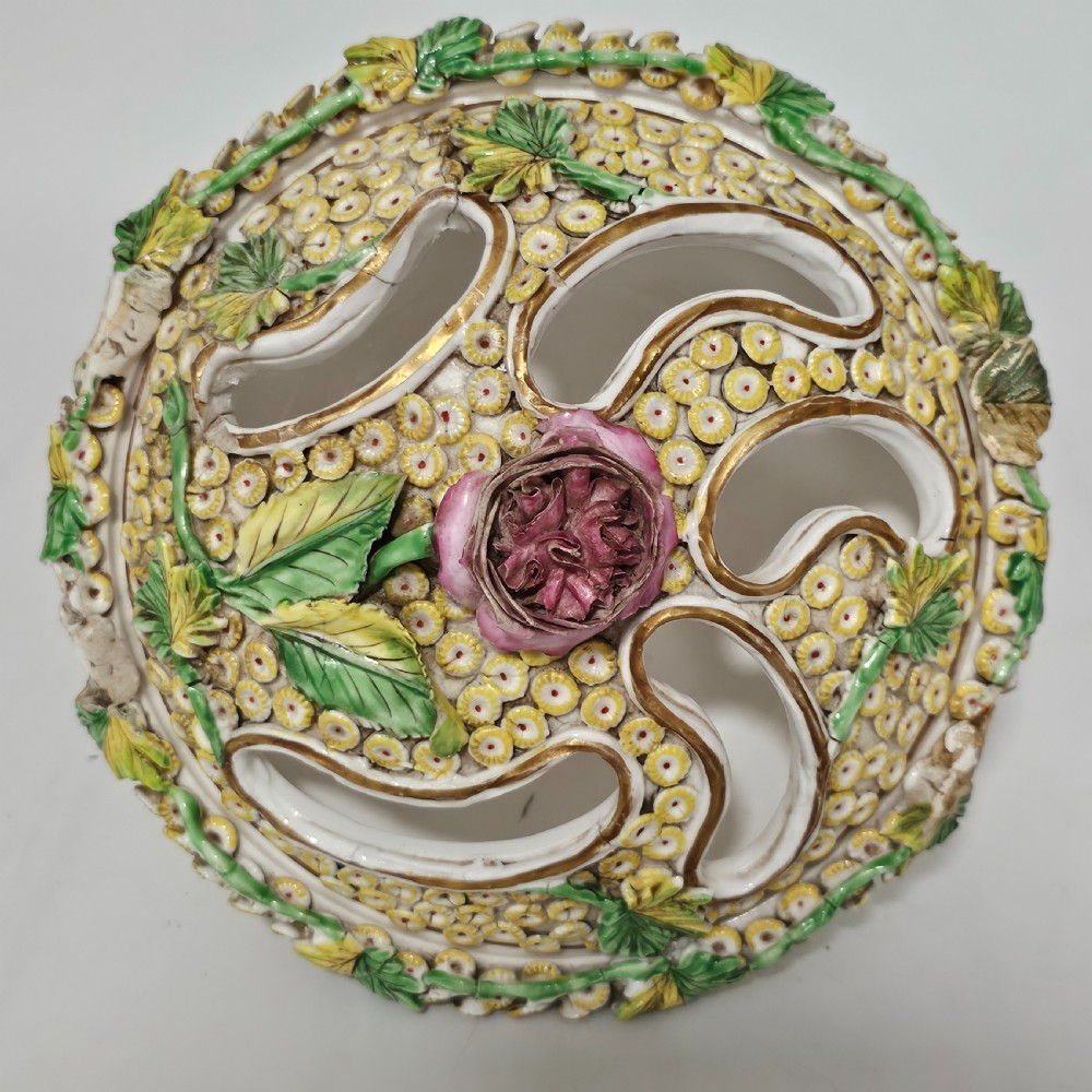 An antique circa 1830 Spode porcelain potpourri bowl with a pierced lid, featuring dense encrusted yellow and green flowers and a central pink rose finial. View XIII