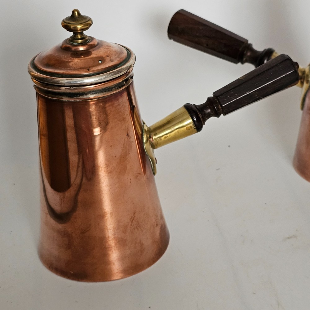Antique Pair of Copper Chocolate Pots with Applied Brass Motifs