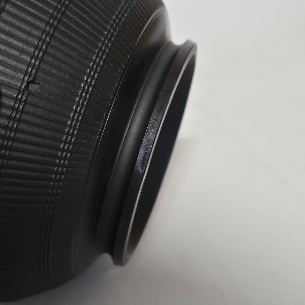 An 18th-century matte black basalt stoneware bowl featuring intricate engine-turned reeded and diced patterns around the exterior. View VI