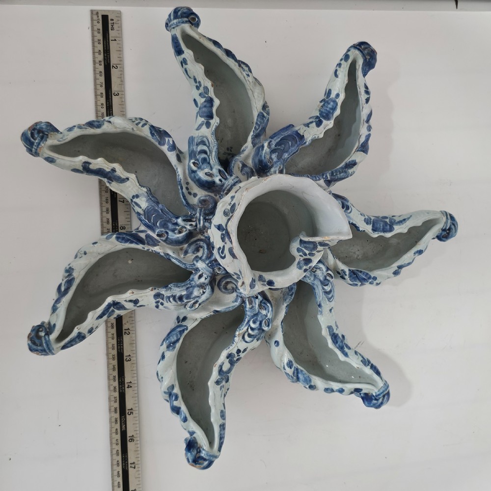 A hand-painted blue and white ceramic starfish dish featuring intricate floral patterns and an elevated central opening. View II