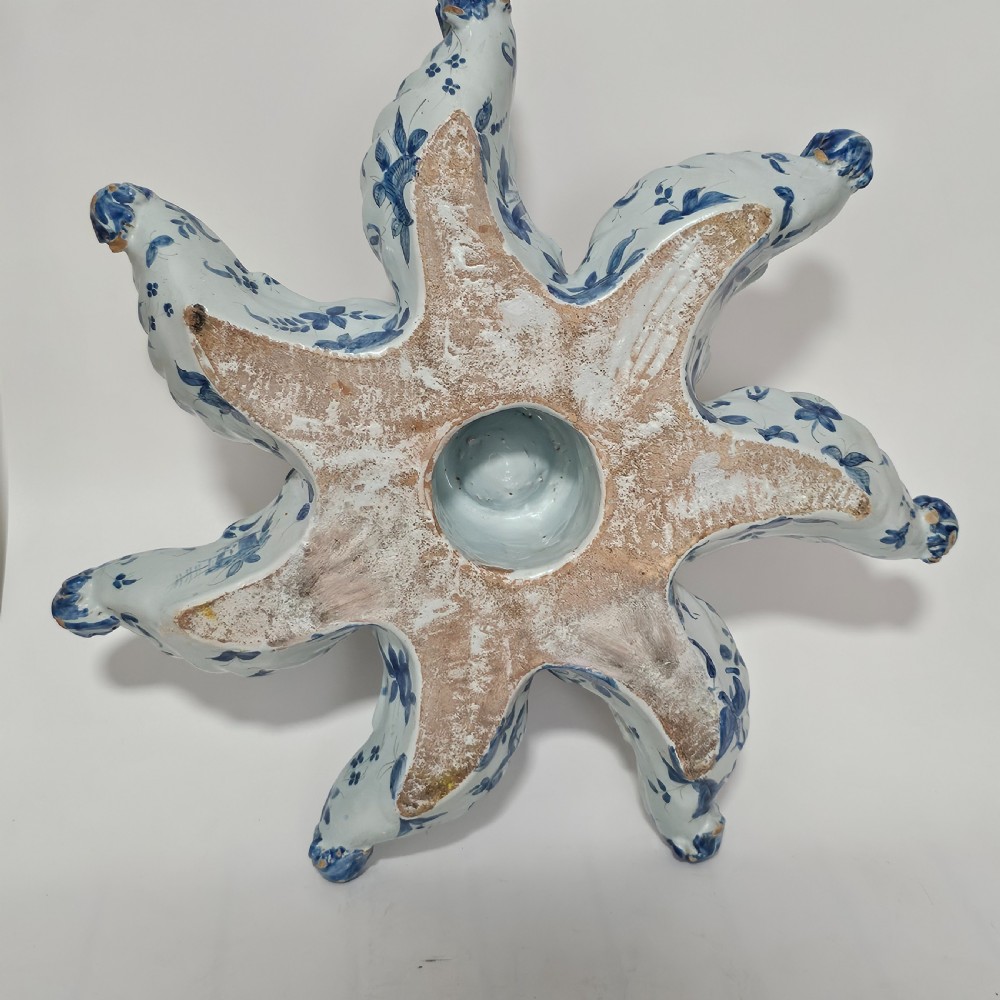 A hand-painted blue and white ceramic starfish dish featuring intricate floral patterns and an elevated central opening. View III
