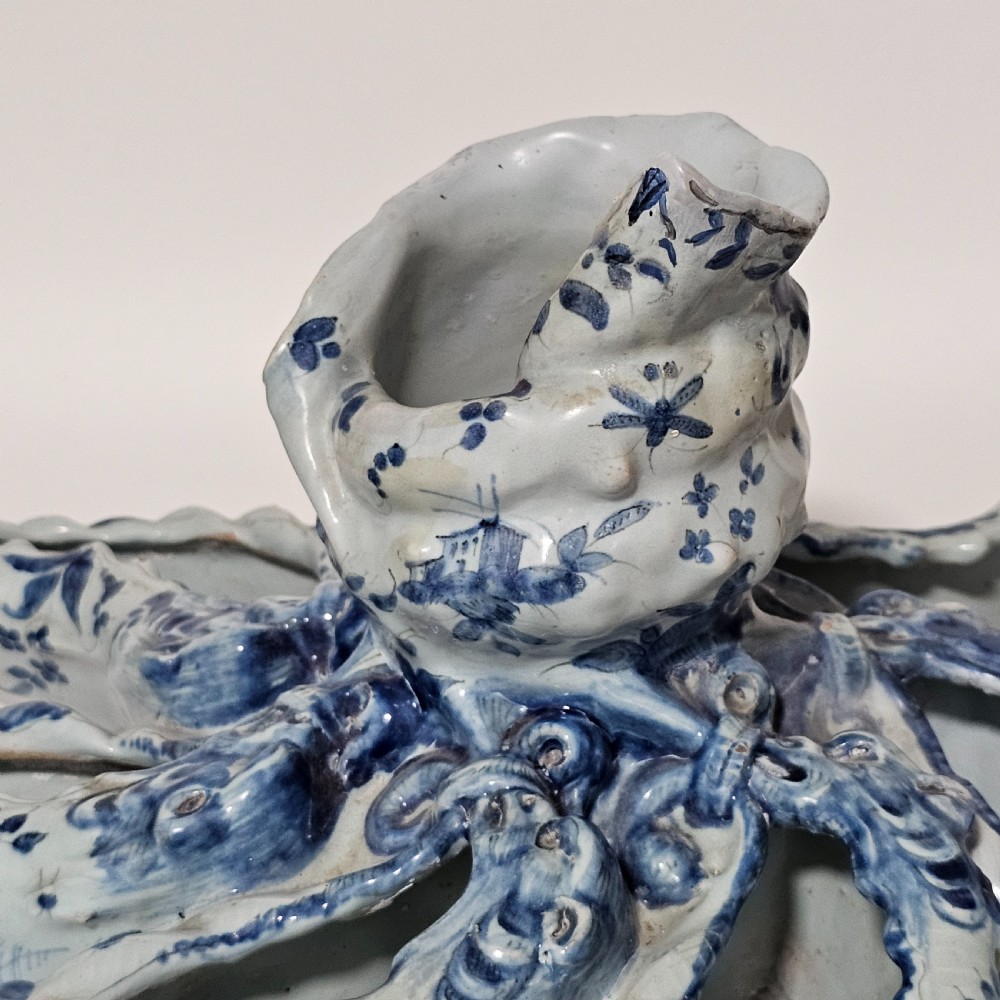 A hand-painted blue and white ceramic starfish dish featuring intricate floral patterns and an elevated central opening. View XI