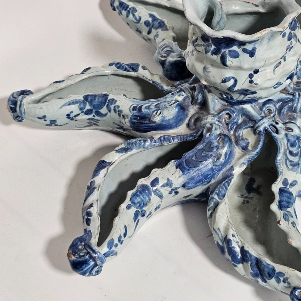 A hand-painted blue and white ceramic starfish dish featuring intricate floral patterns and an elevated central opening. View XIV