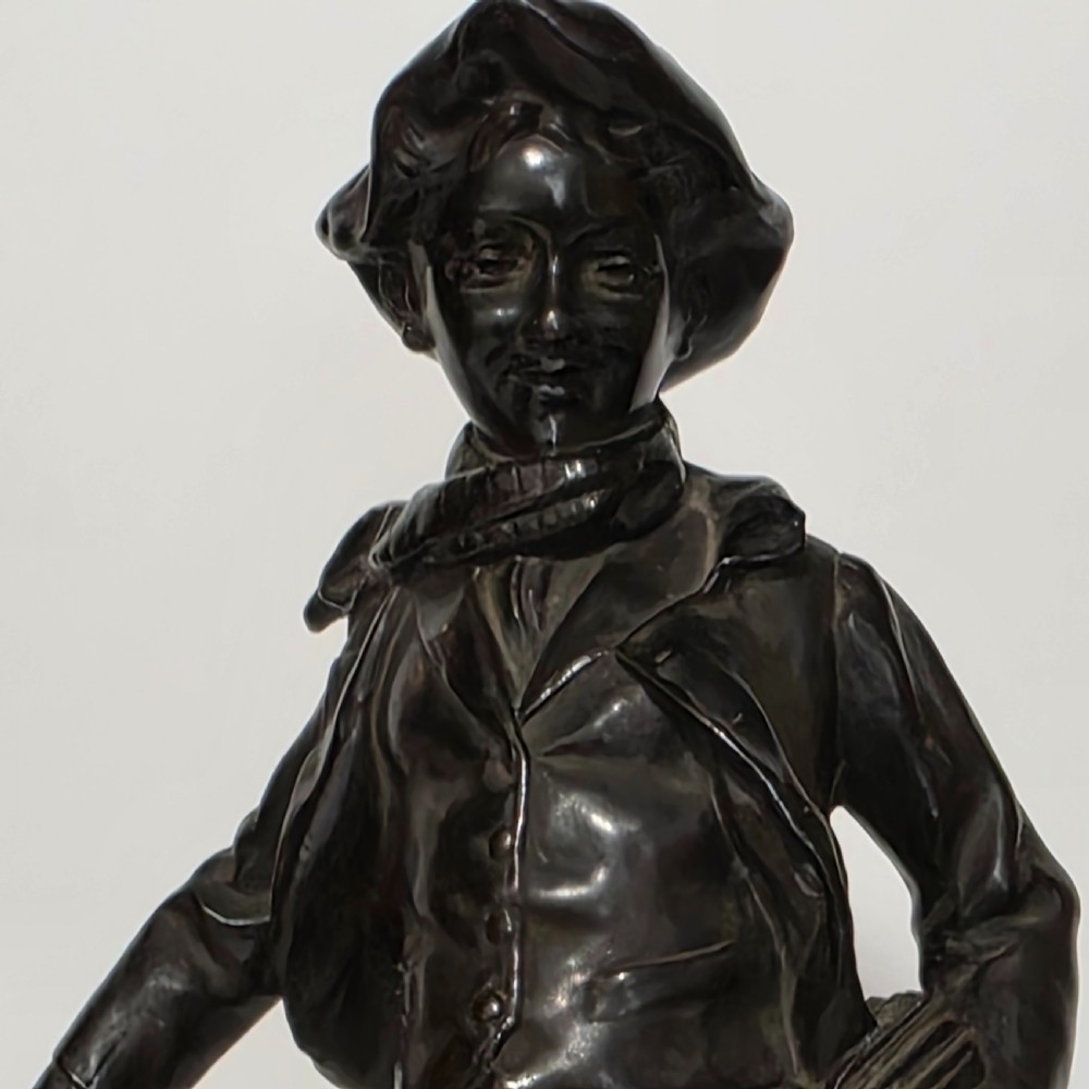 Antoine Bofill (Spanish, 1875-1939), 'La Glissade', 37cm bronze figure of a boy sliding on ice View IV