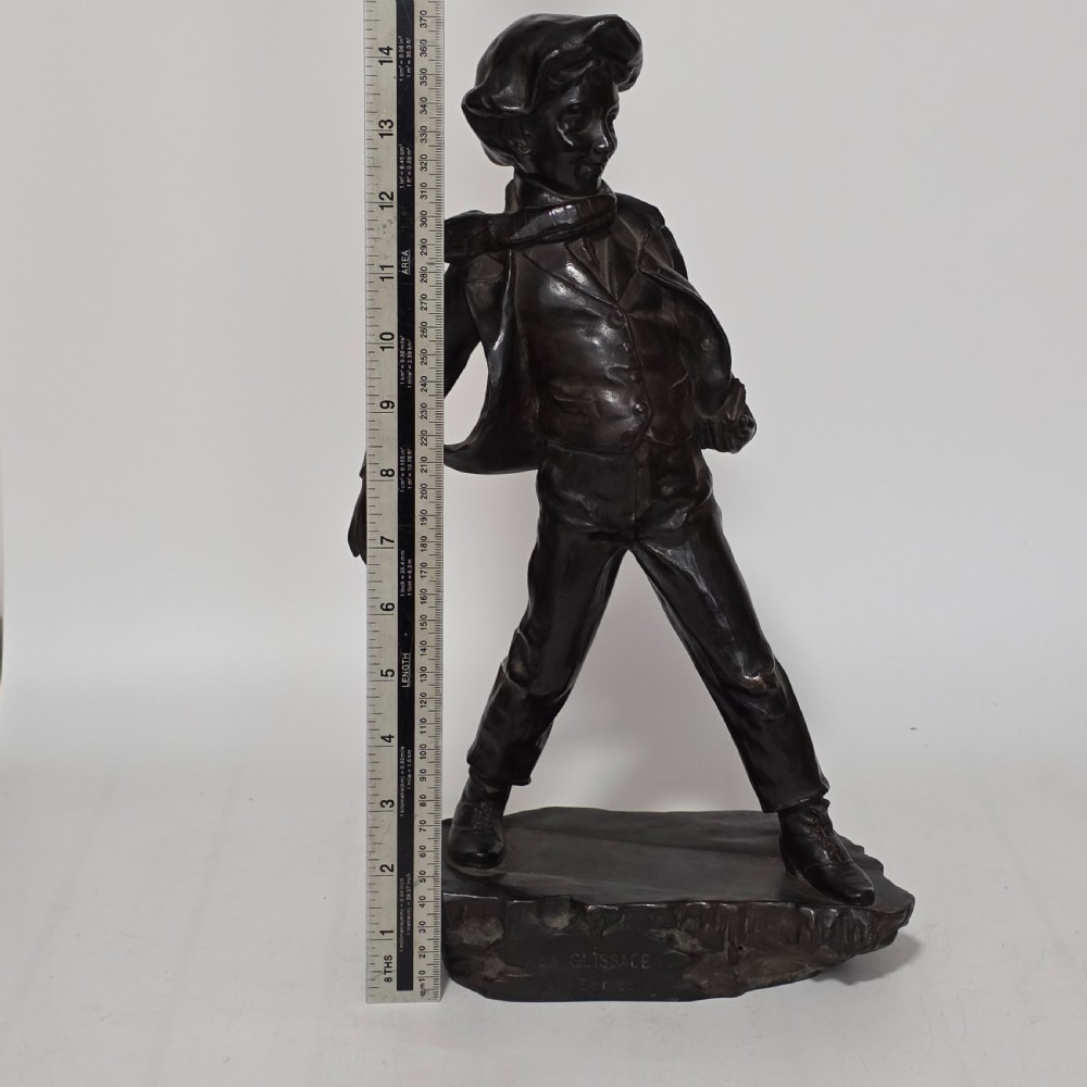 Antoine Bofill (Spanish, 1875-1939), 'La Glissade', 37cm bronze figure of a boy sliding on ice View XX