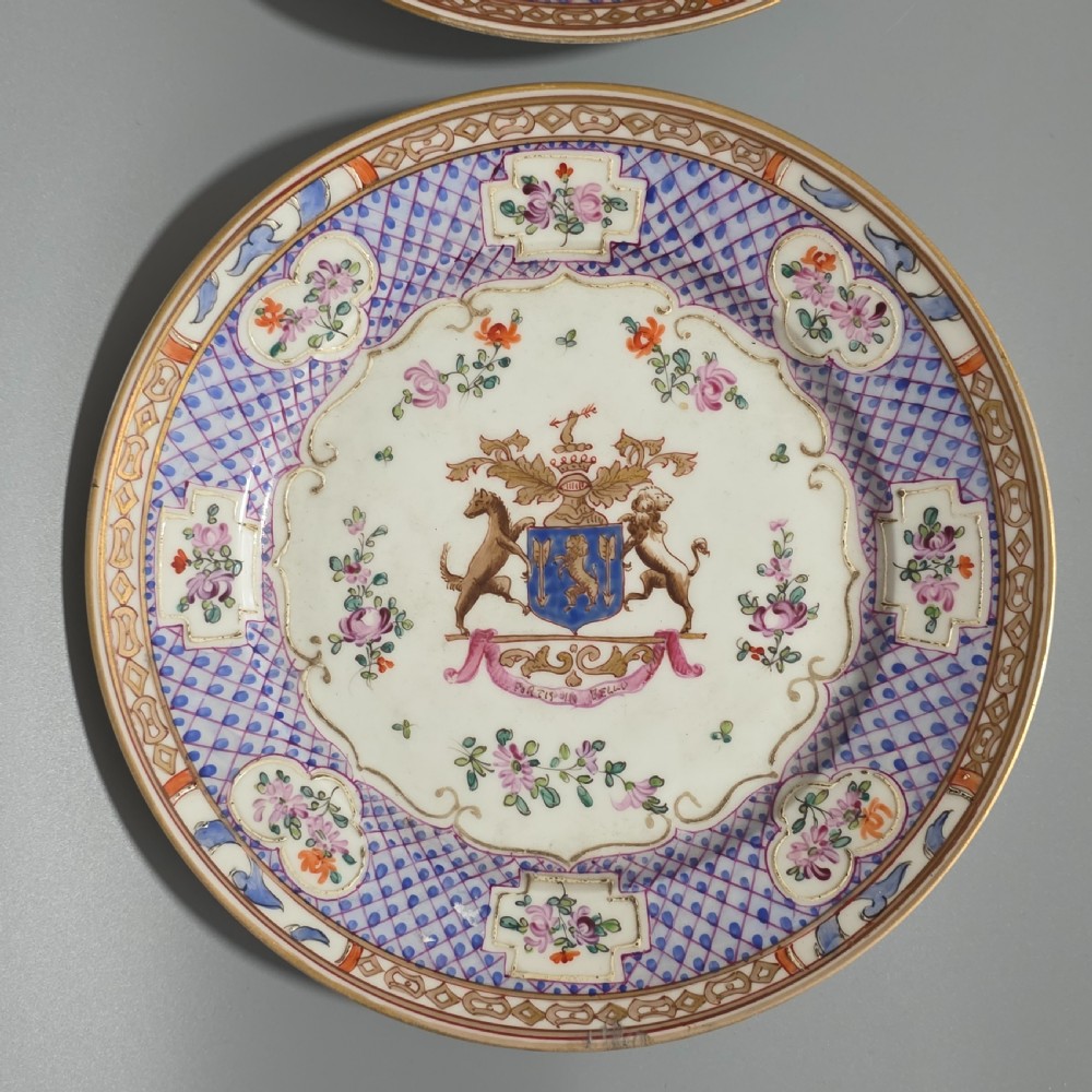 A pair of nineteenth-century Samson porcelain cabinet plates featuring hand-painted coat of arms crests surrounded by floral sprays and purple lattice borders. View II