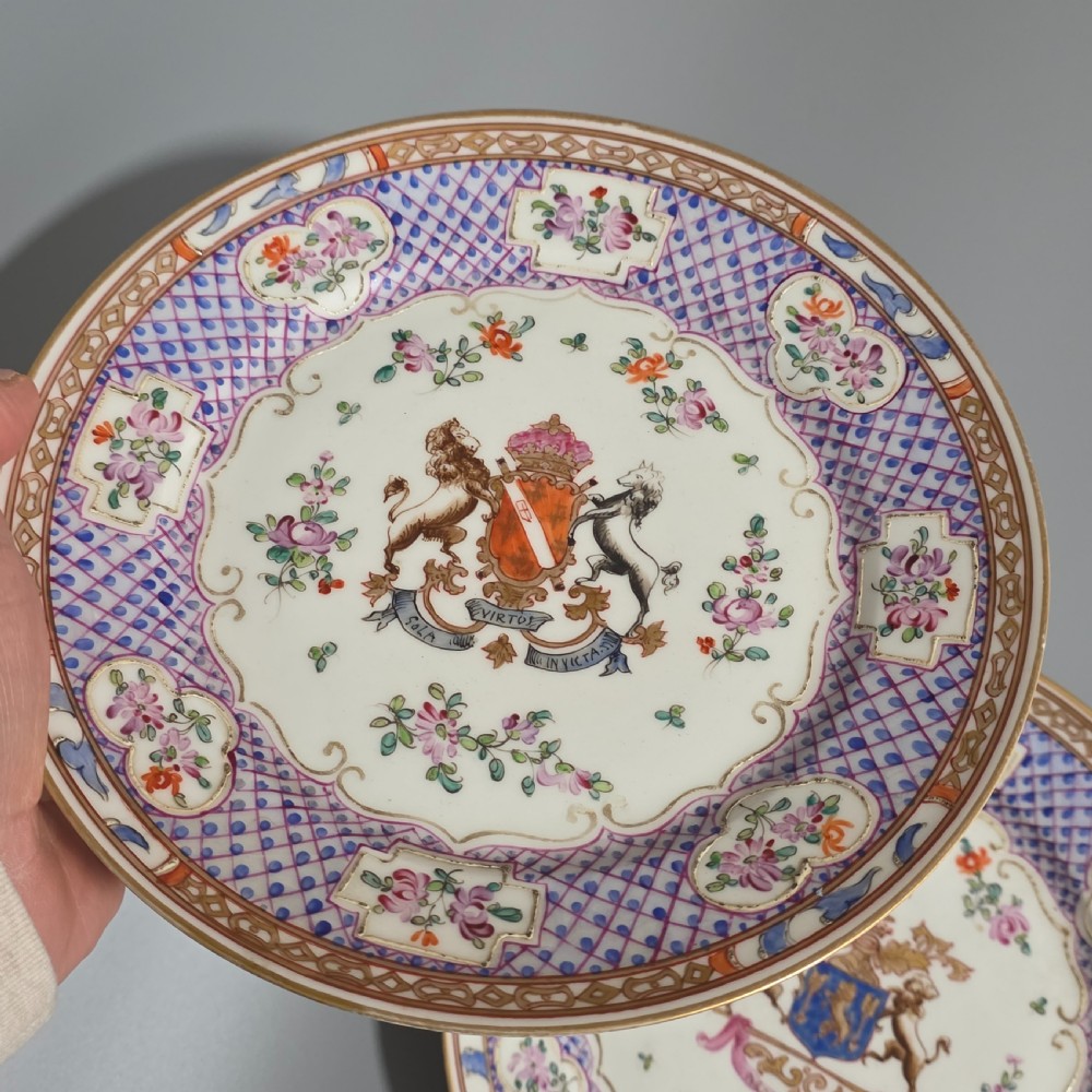 A pair of nineteenth-century Samson porcelain cabinet plates featuring hand-painted coat of arms crests surrounded by floral sprays and purple lattice borders. View VI