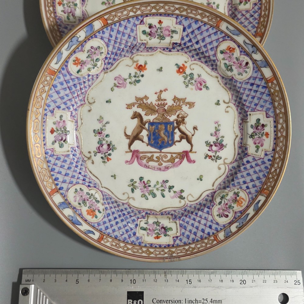 A pair of nineteenth-century Samson porcelain cabinet plates featuring hand-painted coat of arms crests surrounded by floral sprays and purple lattice borders. View IX