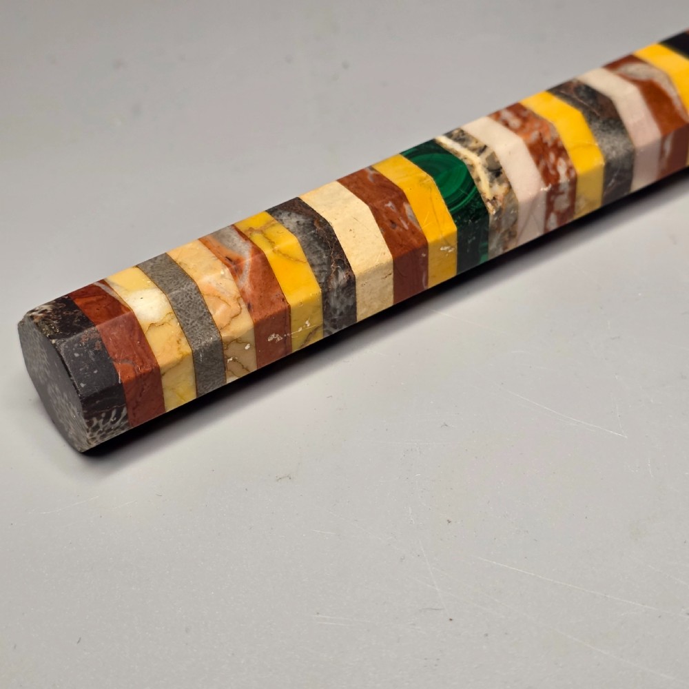 An antique octagonal ruler constructed from alternating segments of multi-coloured specimen marbles, agate, and malachite. View V