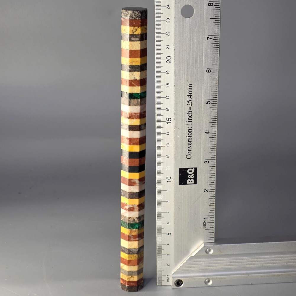 An antique octagonal ruler constructed from alternating segments of multi-coloured specimen marbles, agate, and malachite. View XI