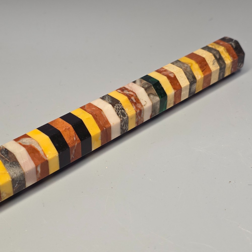 An antique octagonal ruler constructed from alternating segments of multi-coloured specimen marbles, agate, and malachite. View XIII