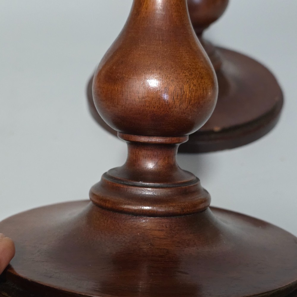 A pair of tall turned dark wood candlesticks featuring bulbous lower shafts and circular stepped bases. View VI