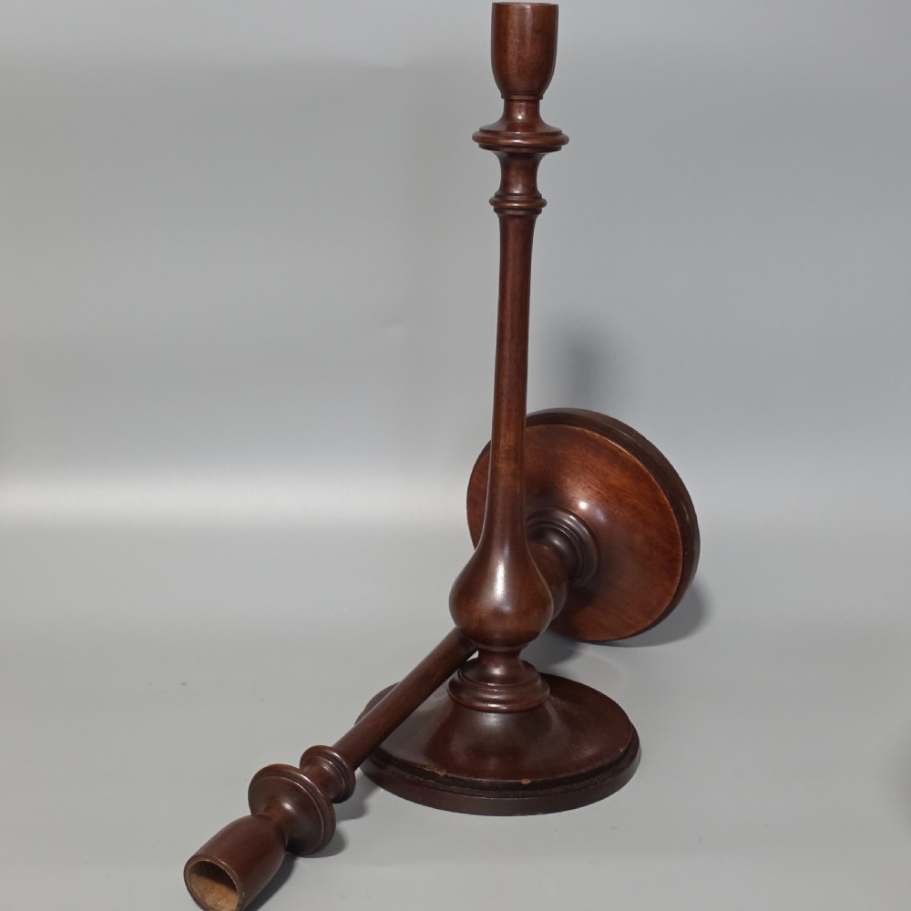 A pair of tall turned dark wood candlesticks featuring bulbous lower shafts and circular stepped bases. View VIII