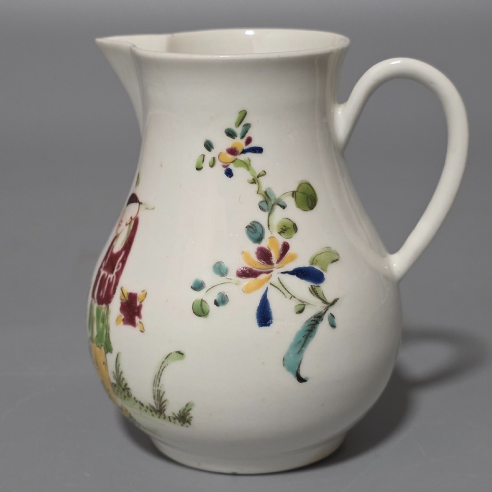 An 18th-century Worcester porcelain sparrow beak cream jug of baluster form, hand-painted with polychrome enamel figures and foliage. View II