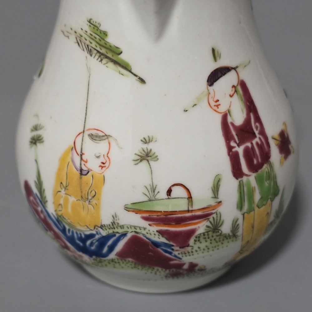 An 18th-century Worcester porcelain sparrow beak cream jug of baluster form, hand-painted with polychrome enamel figures and foliage. View VIII